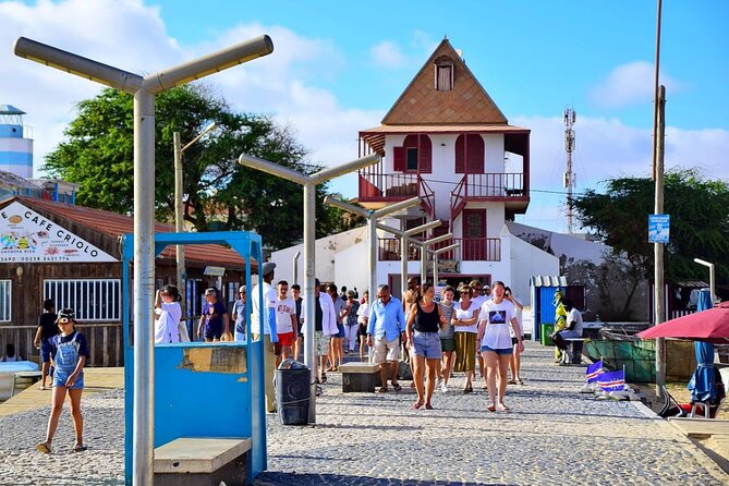 Sal island: Private Santa Maria City Tour, Street Art and Tapas - Old photos, utensils, and the view that ties it together